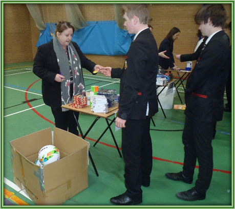 students swapping vouchers for prizes