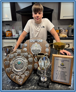 Student with his trophies