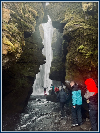students by a waterfall