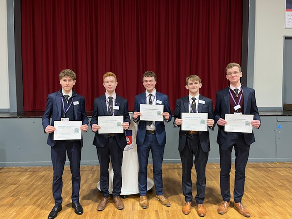 Students holding up their Certificates